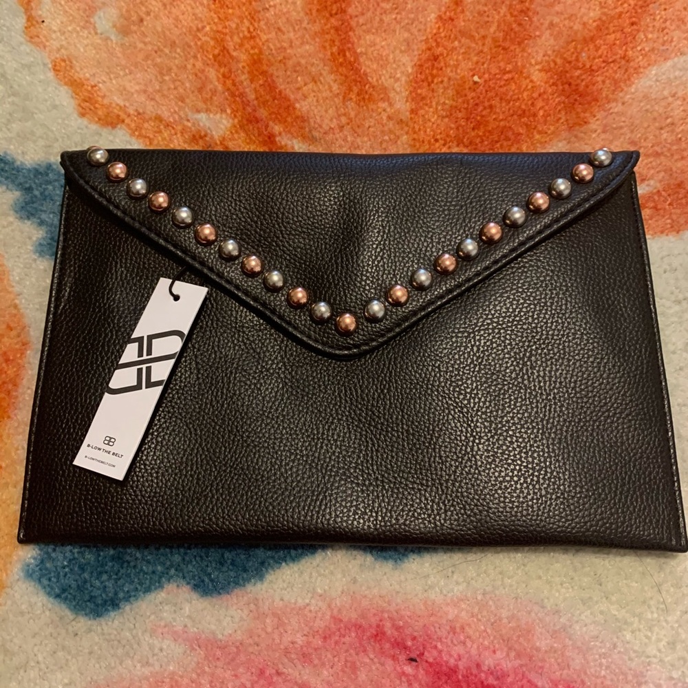 Below the belt studded clutch